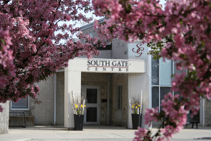 South Gate Centre framed by spring blossom.